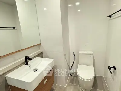 Modern bathroom with sleek fixtures and minimalist design.