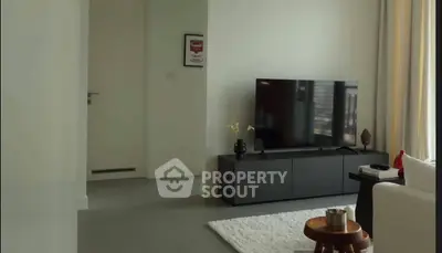 Modern living room with sleek TV setup and stylish decor