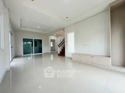Spacious modern living room with sleek design and ample natural light
