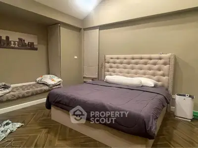 Spacious bedroom with elegant bed and cozy decor