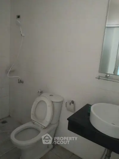 Spacious bathroom with modern fixtures and sleek design, perfect for a contemporary home.