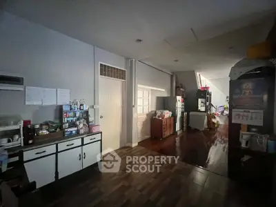 Spacious interior with wooden flooring and ample storage in a cozy home setting.