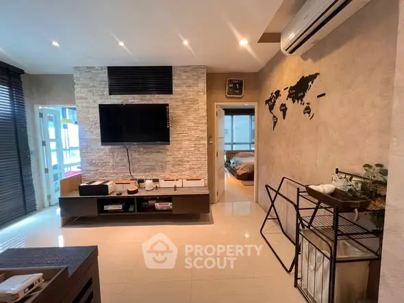 Modern living room with wall-mounted TV and stylish decor