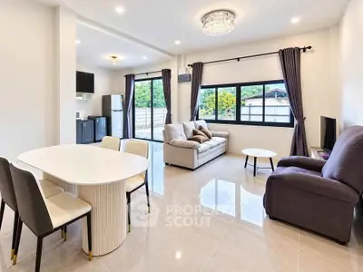 Spacious modern living room with elegant dining area and large windows