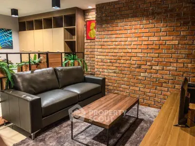 Stylish living room with exposed brick wall and modern furniture