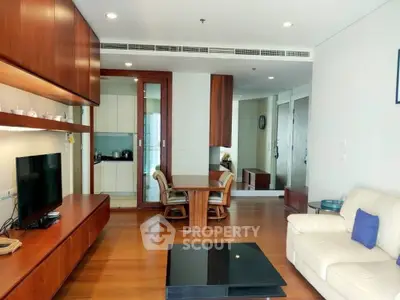 Spacious modern living room with wooden accents and open kitchen layout