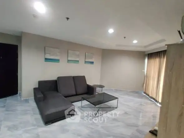 Spacious modern living room with sleek furniture and elegant decor