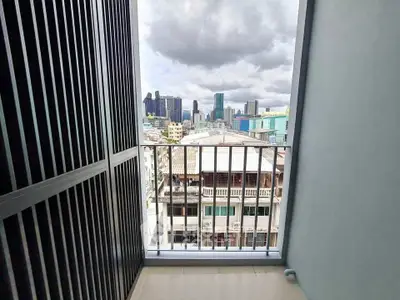 Urban balcony with city skyline view, perfect for enjoying vibrant city life.