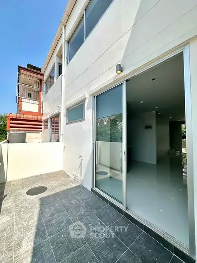 Modern townhouse with spacious balcony and sliding glass doors