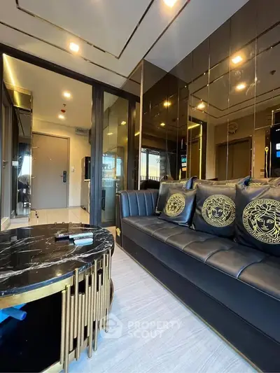 Luxurious modern living room with black leather sofa and elegant decor