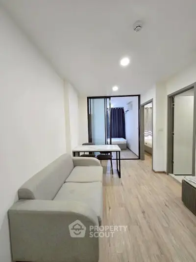 Modern apartment interior with cozy living room and bedroom view