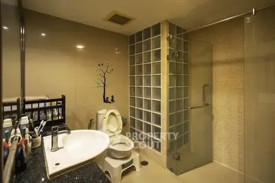 Modern bathroom with glass shower and stylish decor