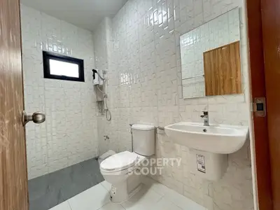 Modern bathroom with sleek fixtures and stylish tile design