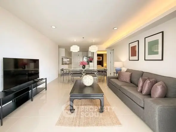 Spacious modern living room with elegant decor and ample natural light.