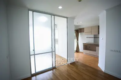 Modern apartment with sliding glass doors and wooden flooring
