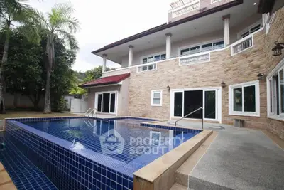 Luxurious villa with stunning pool and elegant stone facade