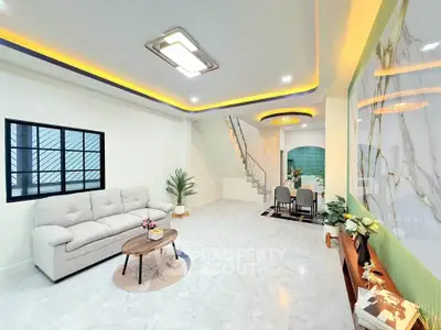 Modern living room with stylish decor and open dining area