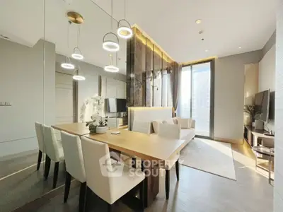 Modern dining area with elegant lighting and large windows in a luxury apartment.