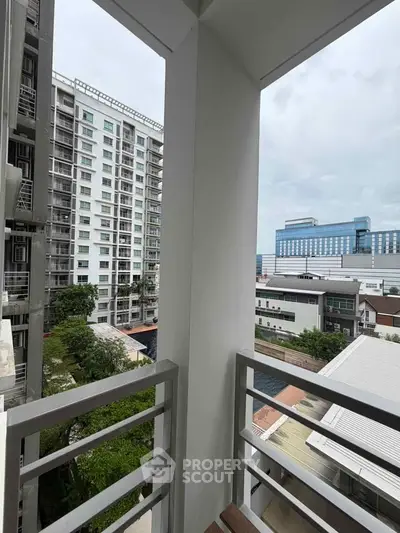 Modern balcony with city view in high-rise apartment building