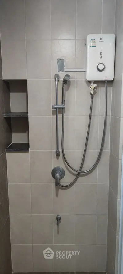 Modern bathroom with sleek shower fixtures and water heater