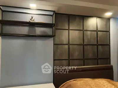 Modern bedroom with stylish wall paneling and decorative shelf