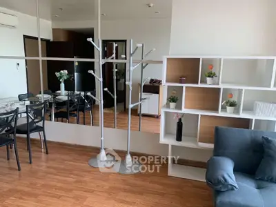 Modern living room with stylish furniture and decorative shelving