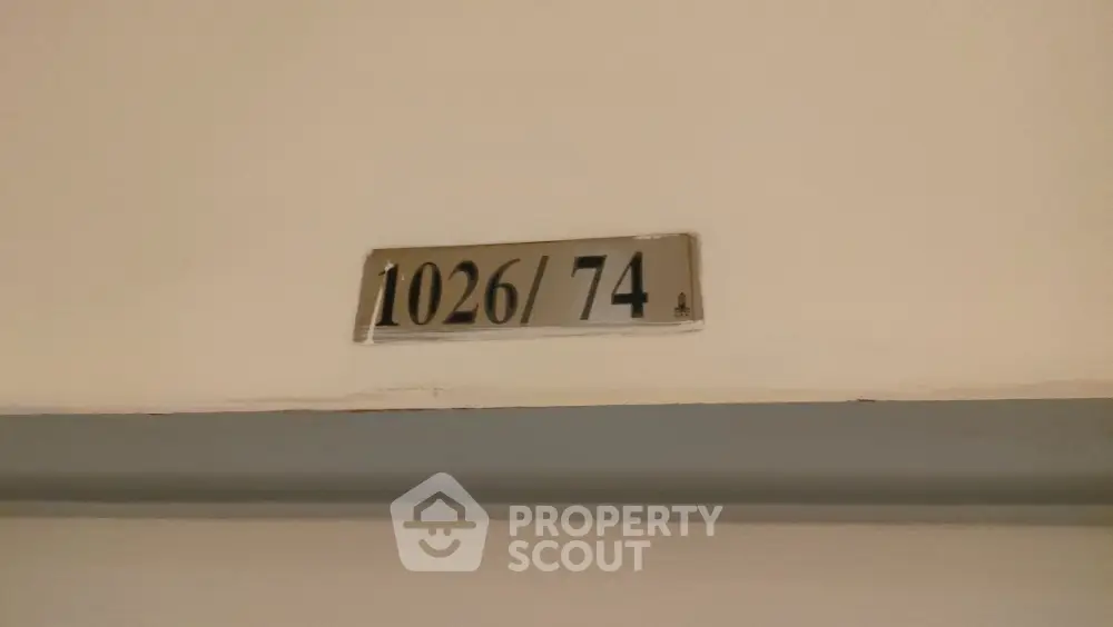 Apartment door number 1026/74 in a residential building