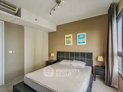 Modern bedroom with stylish decor and natural light