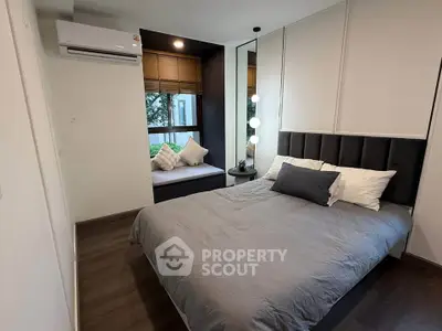 Modern bedroom with stylish decor and large window view