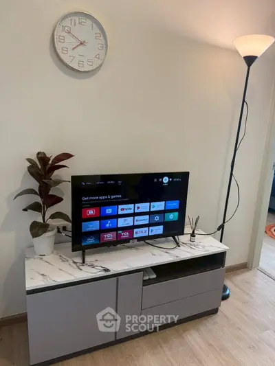 Modern living room with stylish TV stand and floor lamp