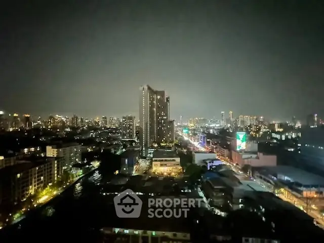 Stunning cityscape night view with illuminated skyline and high-rise buildings.