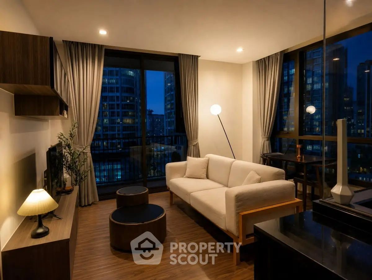 Luxurious modern living room with elegant decor and stunning city view at night.
