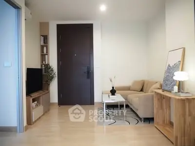 Modern living room with cozy sofa, stylish decor, and wooden flooring in a contemporary apartment.