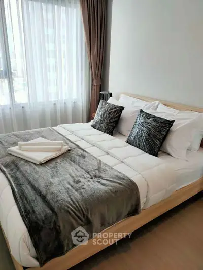 Cozy and modern bedroom with stylish decor and natural light