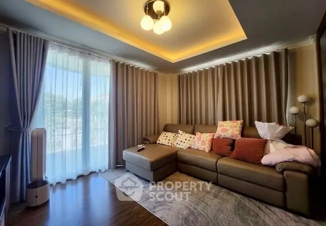 Cozy living room with elegant lighting and plush sofa, perfect for relaxation.