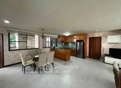 Spacious open-plan living room with modern kitchen and dining area