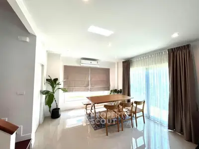 Spacious dining area with natural light and modern decor