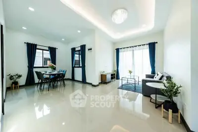 Spacious modern living room with elegant decor and natural light