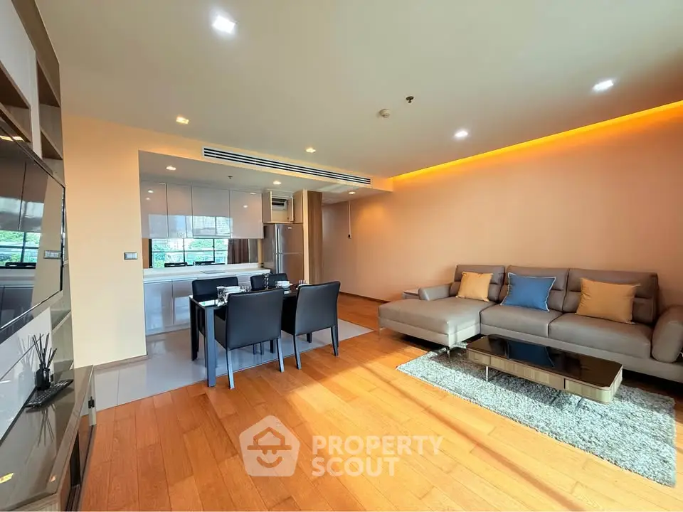 Spacious modern living room with open kitchen and elegant dining area