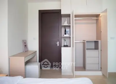 Modern bedroom with open closet and minimalist desk setup