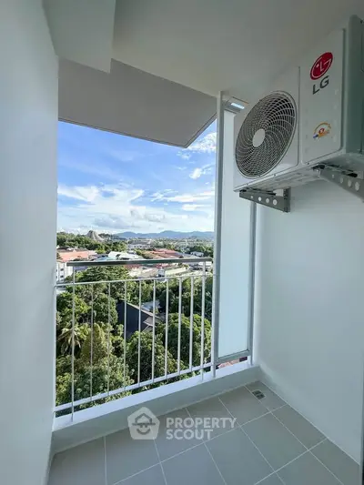Charming balcony with scenic view and air conditioning unit, perfect for relaxation.