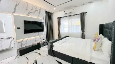 Luxurious modern bedroom with marble accents and stylish decor