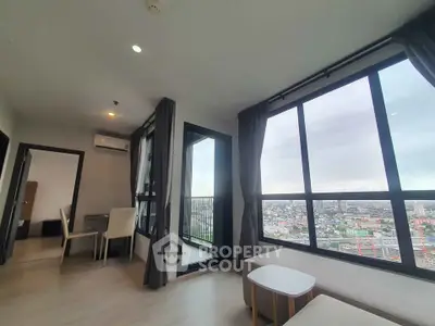 Modern living room with panoramic city view and stylish furniture