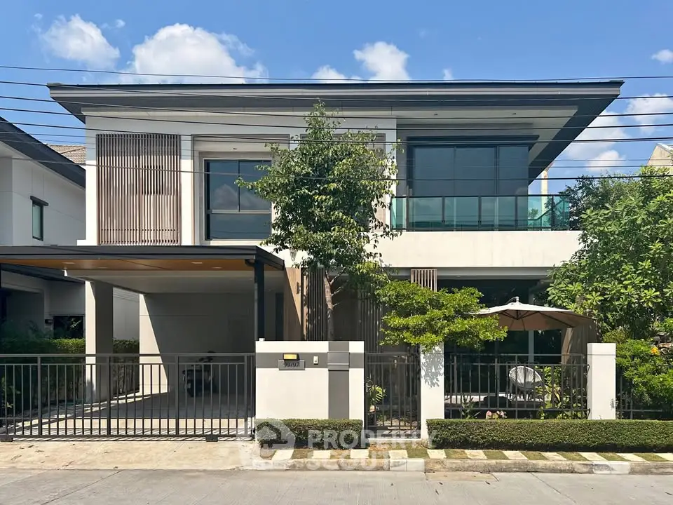 Modern two-story house with sleek design and spacious driveway