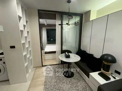 Modern apartment interior with cozy living area and bedroom view