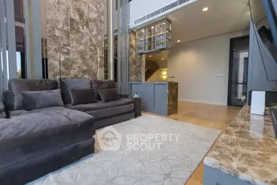 Luxurious living room with plush sofa and elegant marble accents