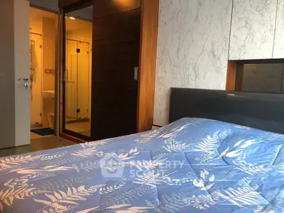 Modern bedroom with ensuite bathroom and stylish decor