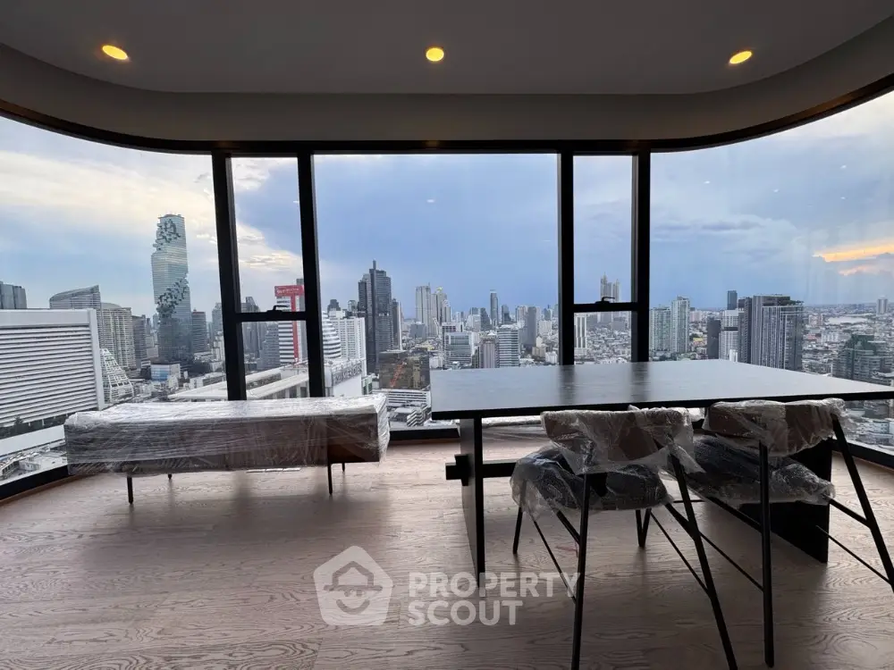 Stunning high-rise apartment with panoramic city skyline views and modern furnishings.