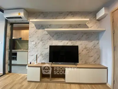Modern living room with stylish TV unit and open kitchen layout