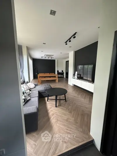 Spacious modern living room with sleek design and elegant furnishings